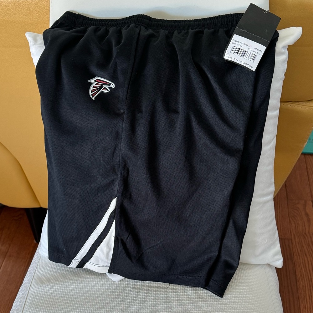 Men’s NfL Falcons new with tags shorts. New with tags men’s size small shorts.